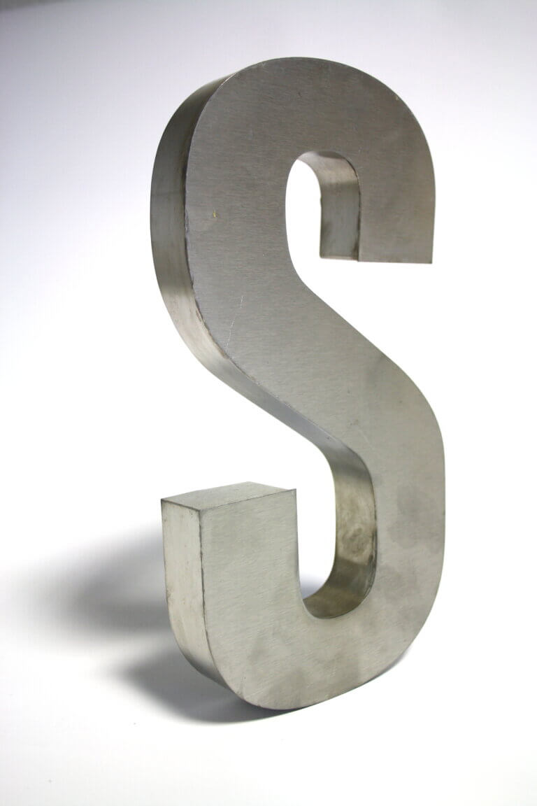 Gray metal s freestanding letter
