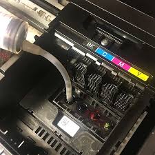 Cleaning a clogged print head with a syringe and hose