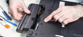 Replacing a user replaceable battery in a laptop